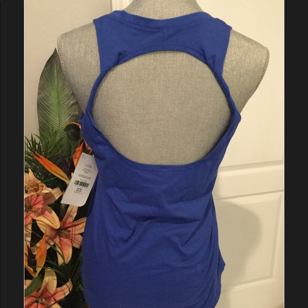 Fabletics top. Blue. Cute back detail. NWT